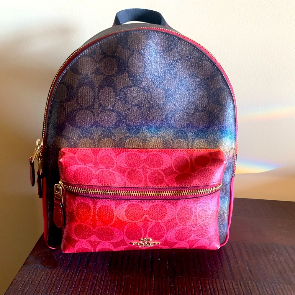 Cutesie pink and brown Coach mini backpack
